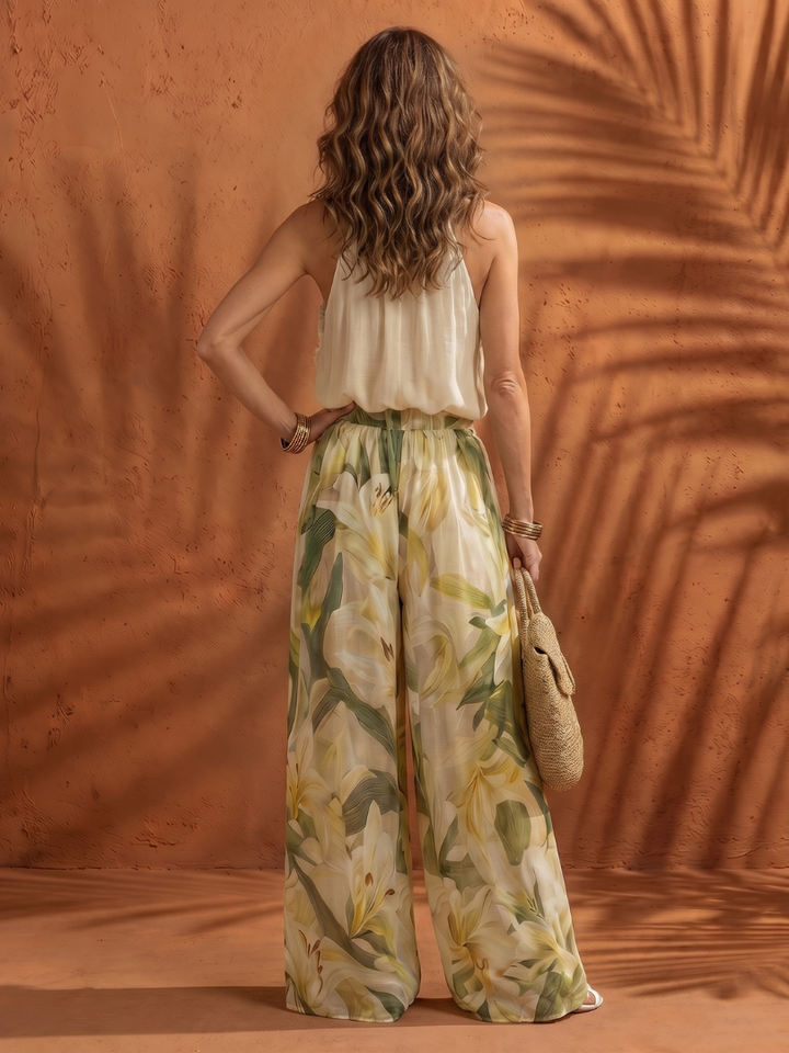 Solange | Souprava s halter halenkou a florálními širokými kalhotami